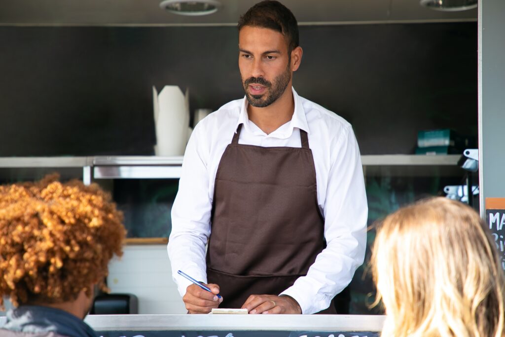 Coffee_Shop_owner_speaking_to_customers